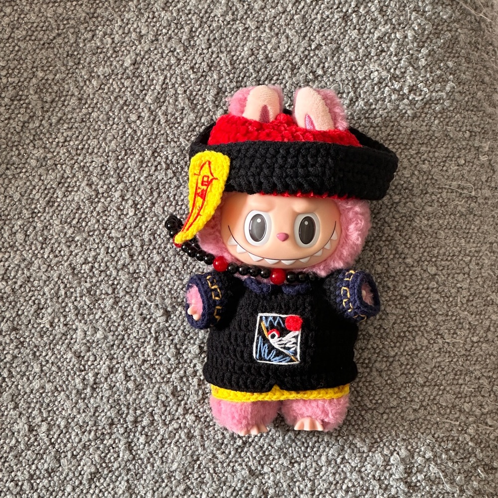 Charming Pink and Black Plush Doll with Yellow Accents